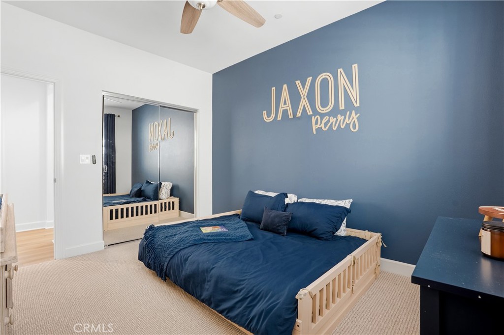 135 Medano Street Rancho Mission Viejo, CA 92694 - Photo 36 of 67 a bedroom with a bed and a table