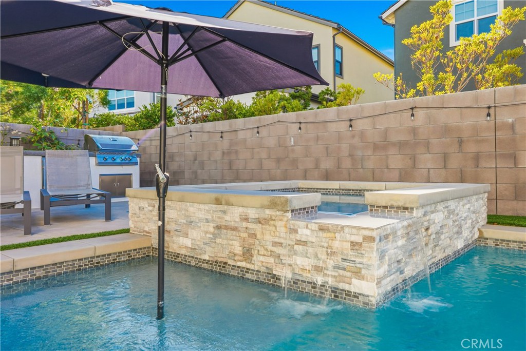 135 Medano Street Rancho Mission Viejo, CA 92694 - Photo 46 of 67 a view of a swimming pool with a patio