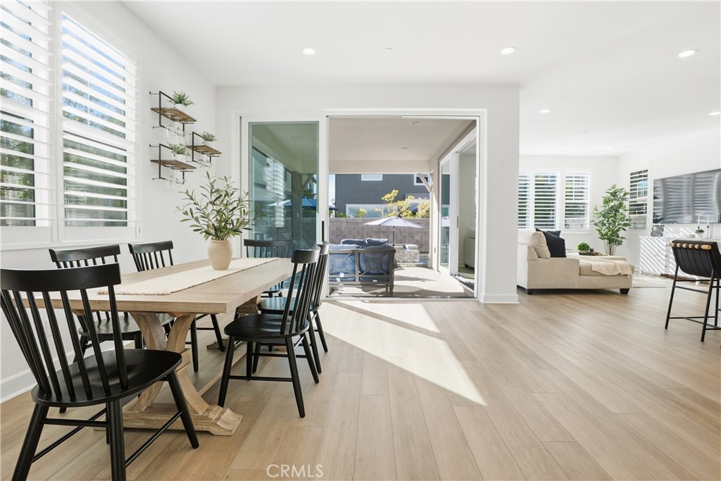 135 Medano Street Rancho Mission Viejo, CA 92694 - Photo 5 of 67 a dining room with furniture and wooden floor