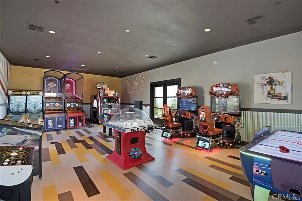 135 Medano Street Rancho Mission Viejo, CA 92694 - Photo 57 of 67 a living room with lots of furniture and gym equipment