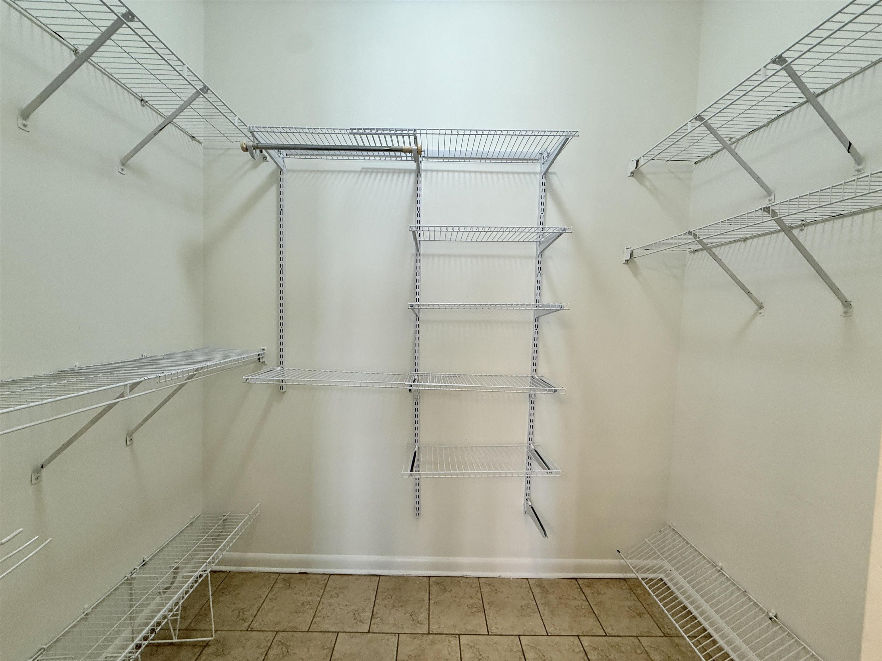 449 Monroe Avenue, Unit 104 Memphis, TN 38103 - Photo 14 of 24 a bathroom with a glass shower door