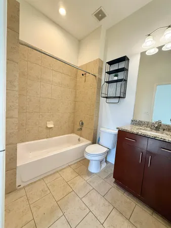 a bathroom with a sink a toilet and bathtub