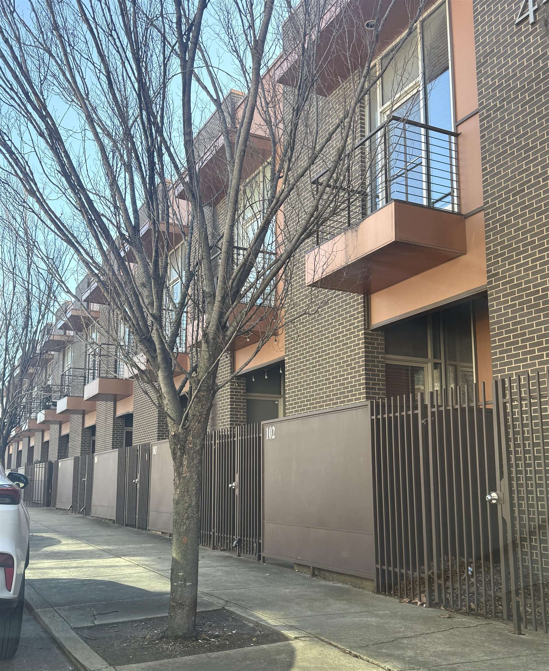 449 Monroe Avenue, Unit 104 Memphis, TN 38103 - Photo 24 of 24 a front view of a house with a tree