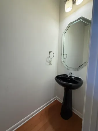 a bathroom with a sink and mirror