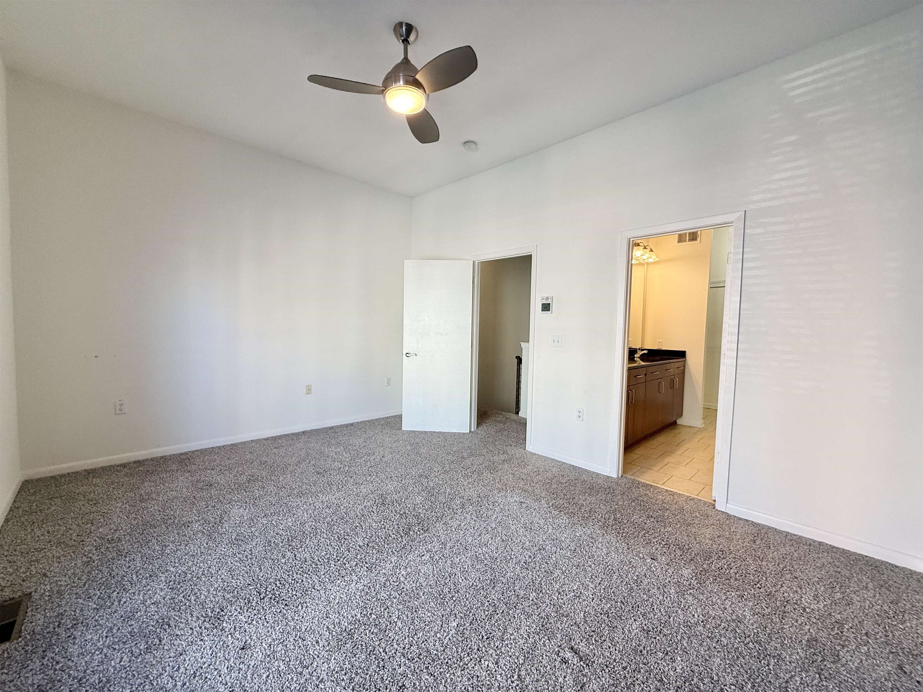 449 Monroe Avenue, Unit 104 Memphis, TN 38103 - Photo 10 of 24 a view of a big room with closet and a ceiling fan