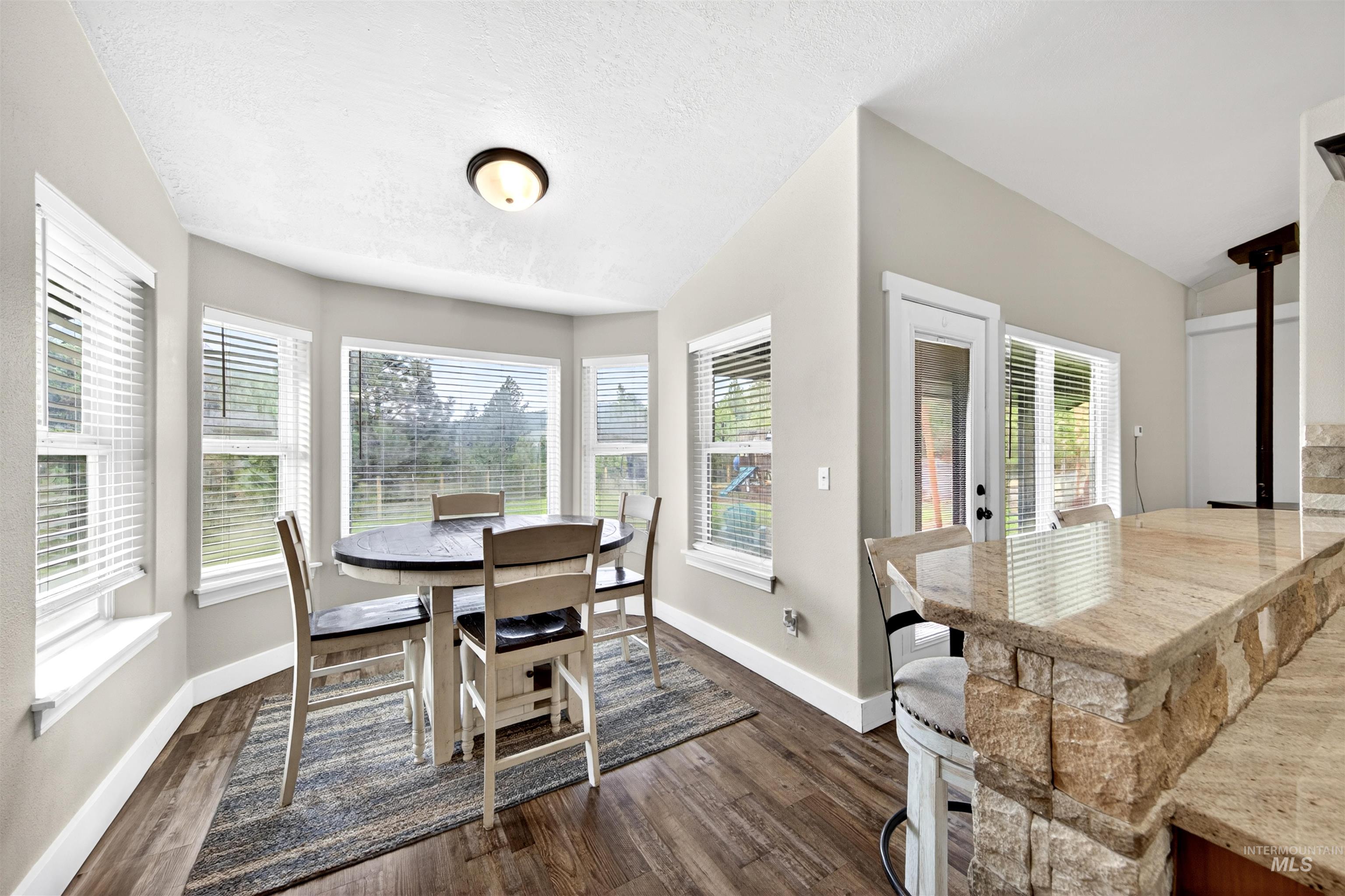 4 Round Up Circle Boise, ID 83716 - Photo 13 of 47 Bay window dining area with wood-finish flooring