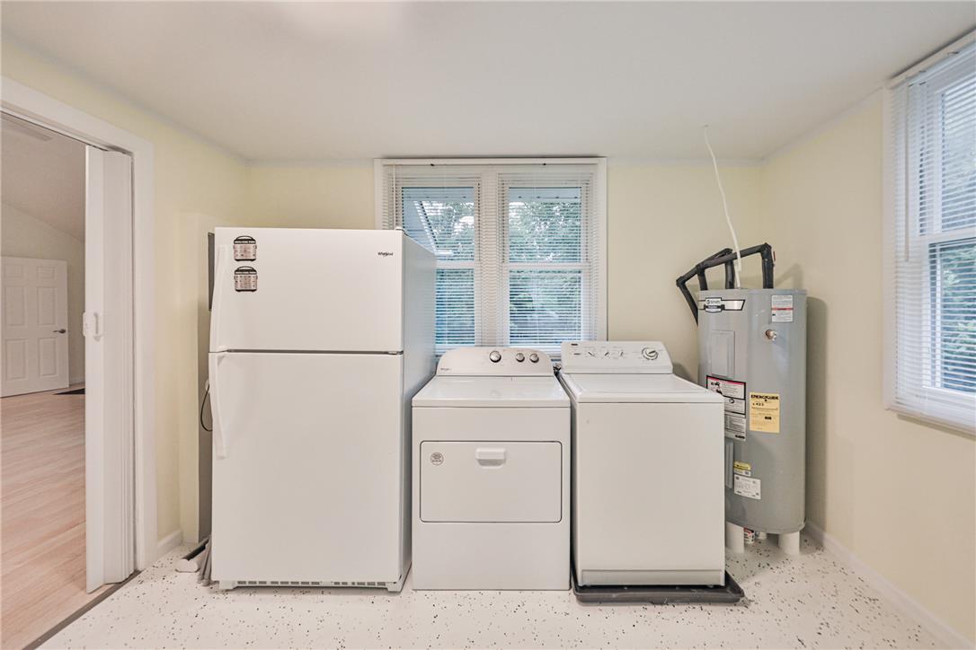 5599 Minks Pond Road Bushkill, PA 18324 - Photo 19 of 64 Functional laundry space featuring durable flooring and ample light.