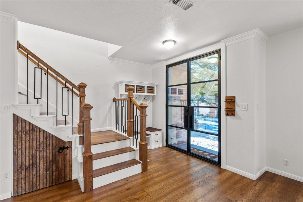 3901 Caney Creek Road Austin, TX 78732 - Photo 2 of 18 Entry features stunning double glass doors. Cupboard for shoes and coats. Extra storage under the staircase.