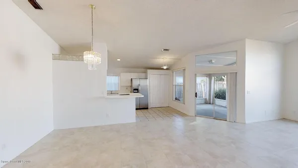 a view of a kitchen with a sink and cabinets