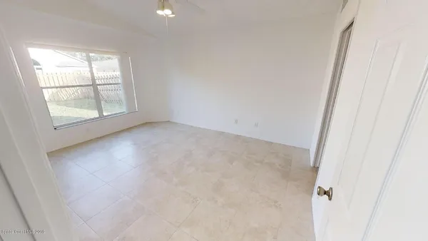 an empty room with windows
