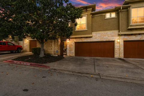 a front view of a house with a garage