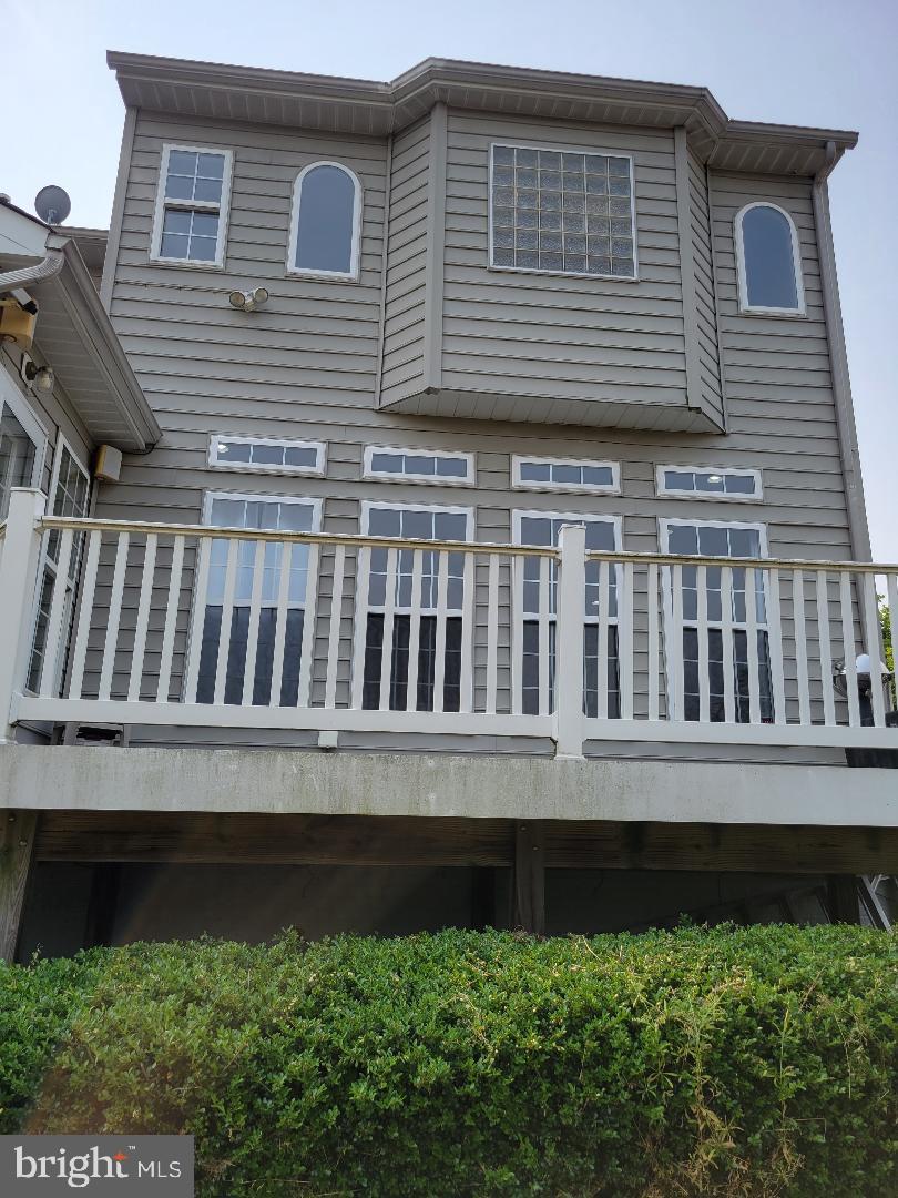 7606 Killbarron Drive Laurel, MD 20707 - Photo 23 of 63 partial Rear view of home and deck