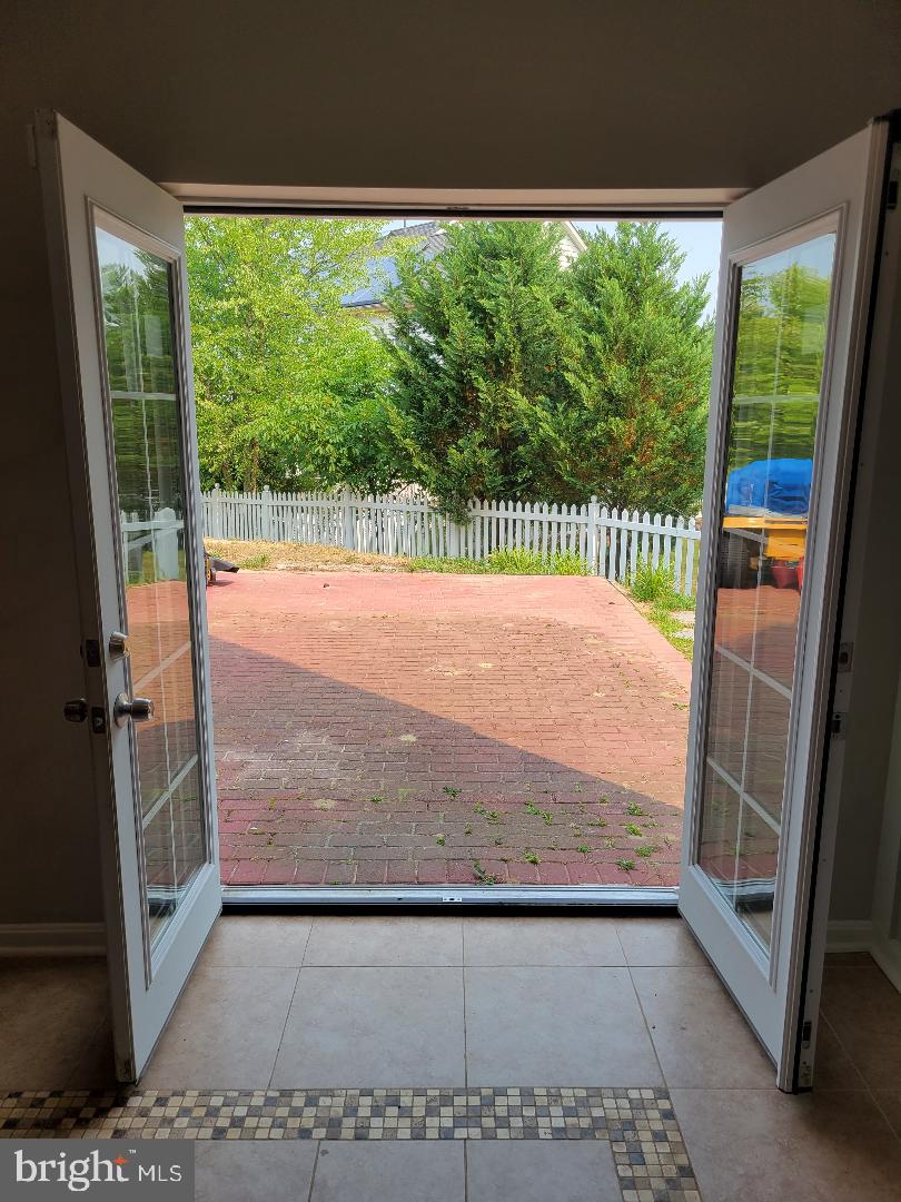 7606 Killbarron Drive Laurel, MD 20707 - Photo 54 of 63 French door exit to brick patio