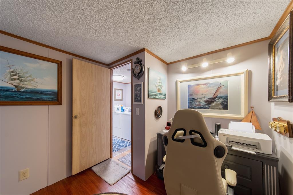 1381 Southeast Lake Road Arcadia, FL 34266 - Photo 12 of 38 a view of a hallway with workspace and a window
