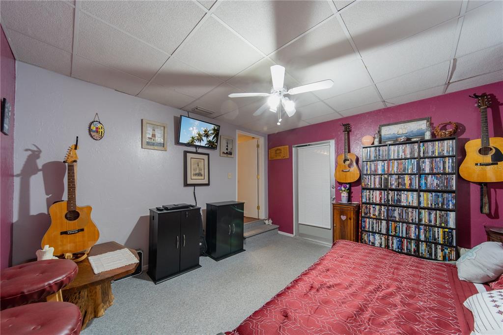 1381 Southeast Lake Road Arcadia, FL 34266 - Photo 14 of 38 a bedroom with a bed and wooden floor