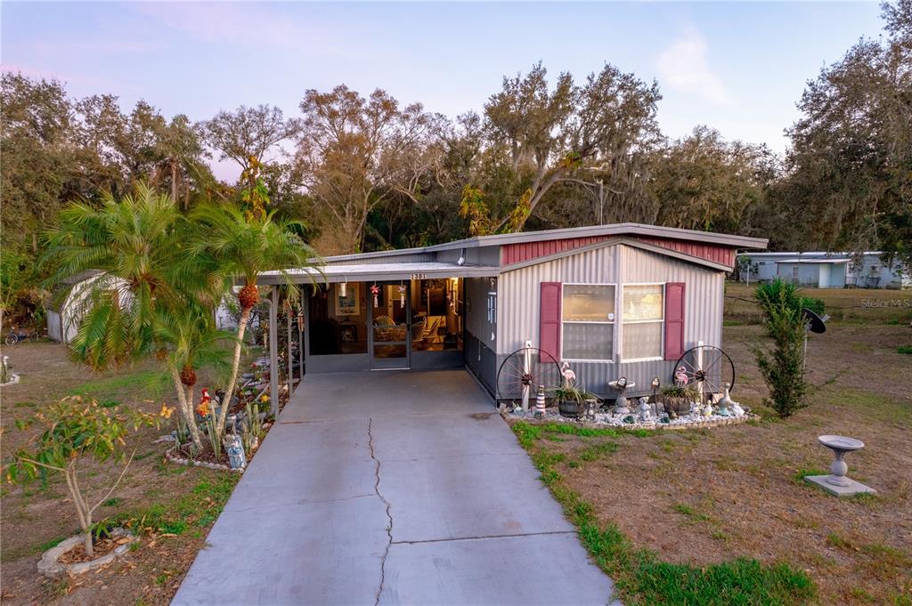 1381 Southeast Lake Road Arcadia, FL 34266 - Photo 2 of 38 a view of house covered with trees in the background
