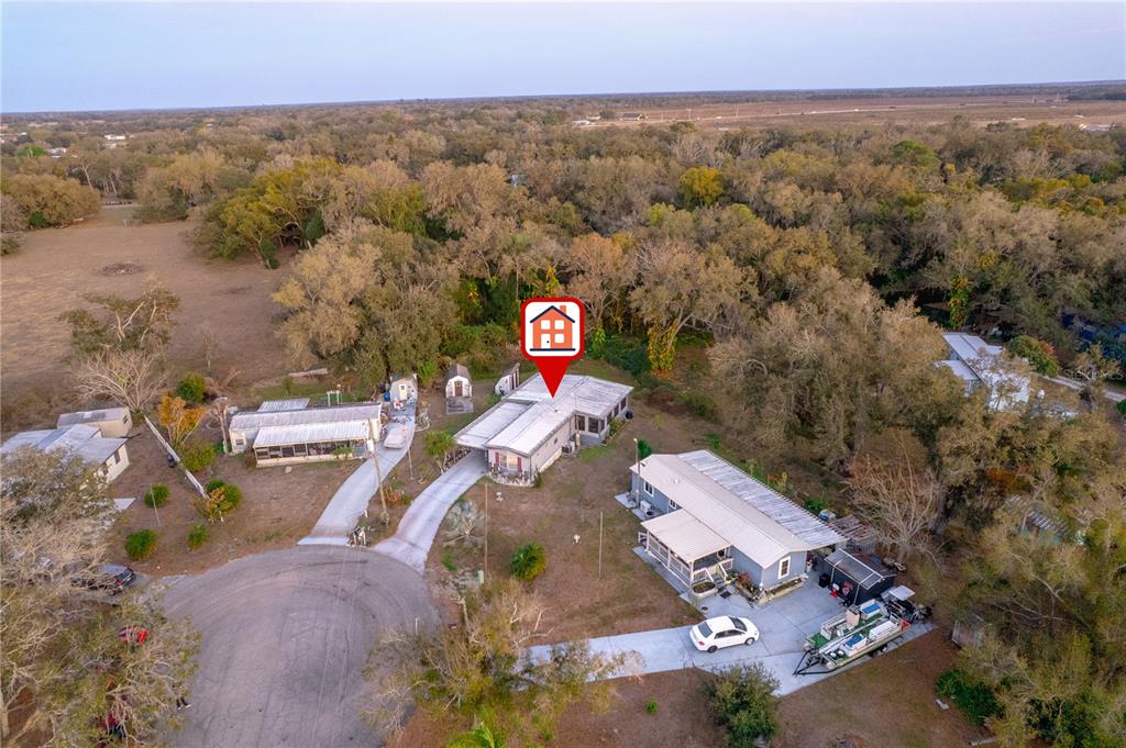 1381 Southeast Lake Road Arcadia, FL 34266 - Photo 3 of 38 an aerial view of a house with a yard