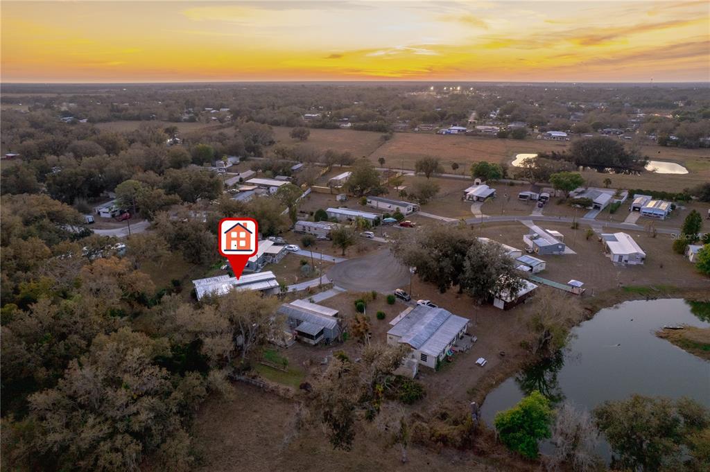 1381 Southeast Lake Road Arcadia, FL 34266 - Photo 36 of 38 an aerial view of residential houses with outdoor space
