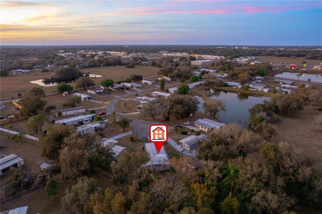 1381 Southeast Lake Road Arcadia, FL 34266 - Photo 37 of 38 an aerial view of green landscape with trees