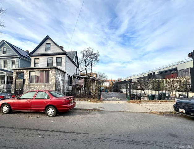 a view of a car parked in front of a house
