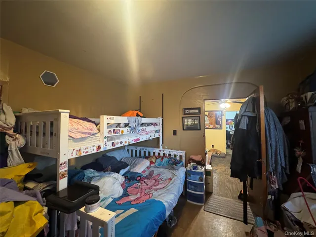 a bedroom with furniture and a window