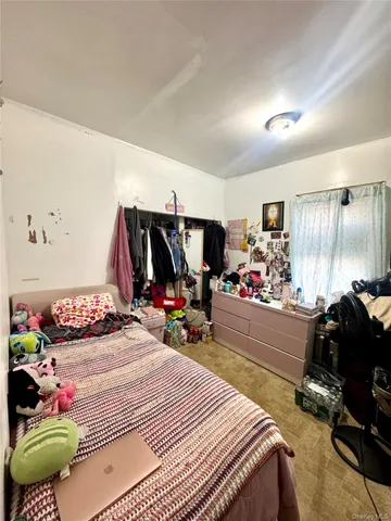 a bedroom with a bed and a table