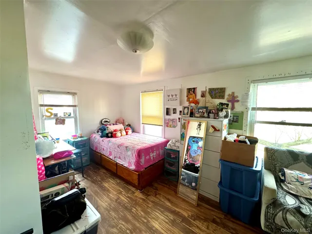 a bedroom with bed and a window