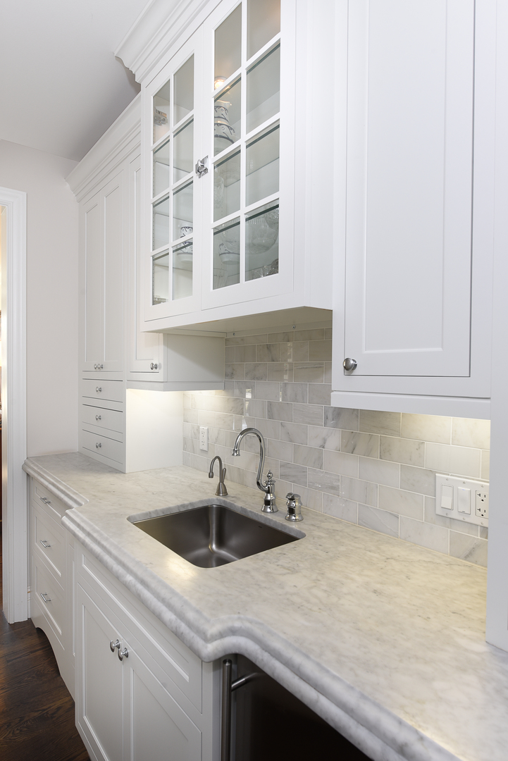 373 Elder Lane Winnetka, IL 60093 - Photo 19 of 53 a kitchen with a sink and cabinets