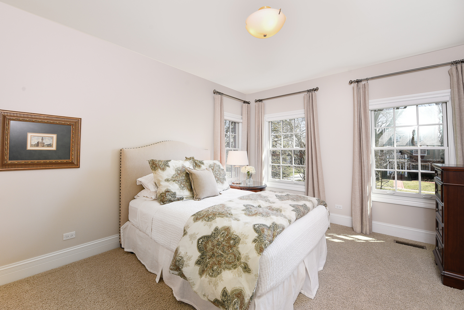 373 Elder Lane Winnetka, IL 60093 - Photo 27 of 53 a large bed sitting in a bedroom next to a window