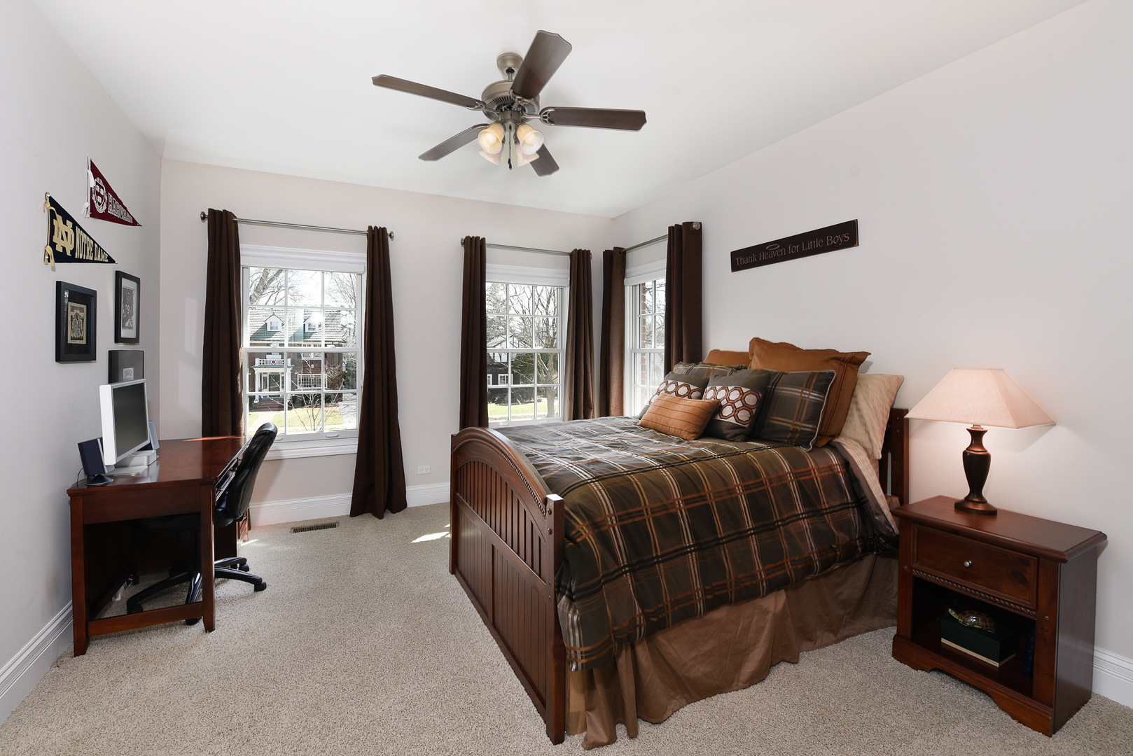 373 Elder Lane Winnetka, IL 60093 - Photo 28 of 53 a bedroom with a bed a chair and a large window