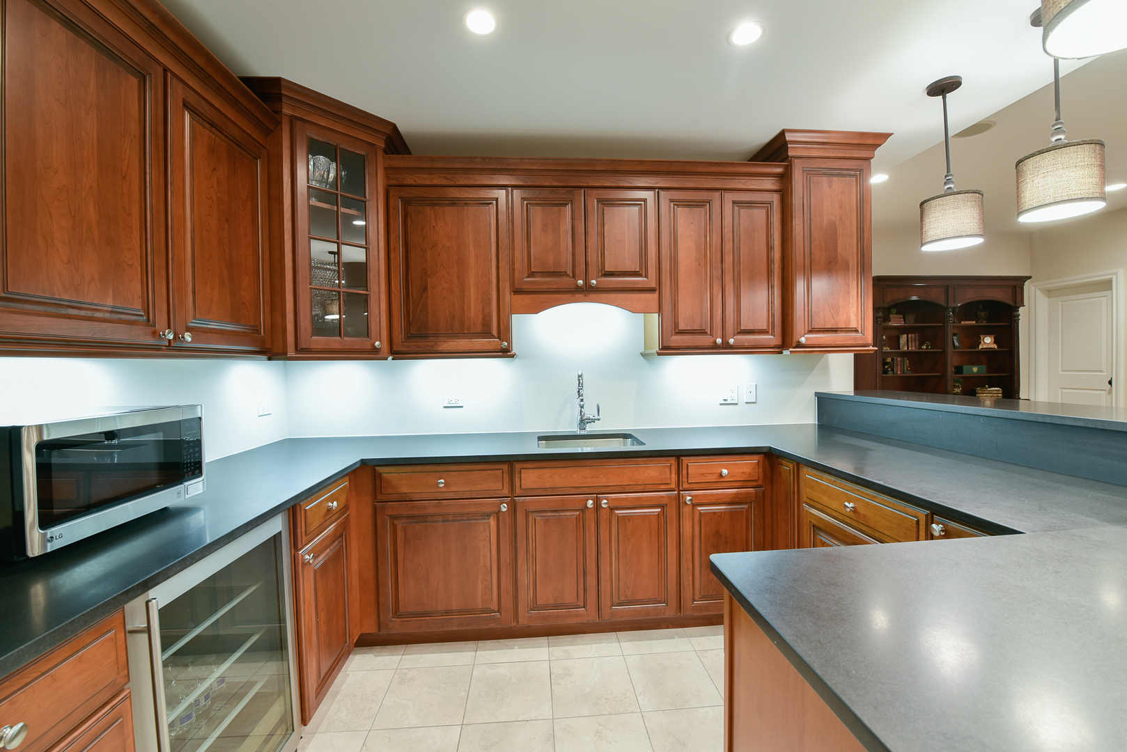 373 Elder Lane Winnetka, IL 60093 - Photo 32 of 53 a kitchen with granite countertop a sink and cabinets
