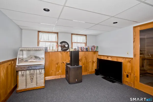 a room with gym equipment and large mirror