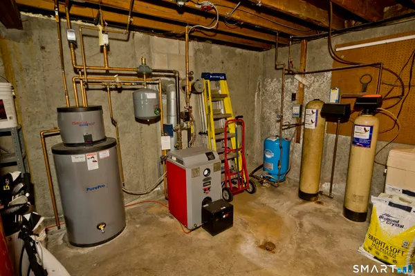 a roof deck with table and chairs and wooden floor