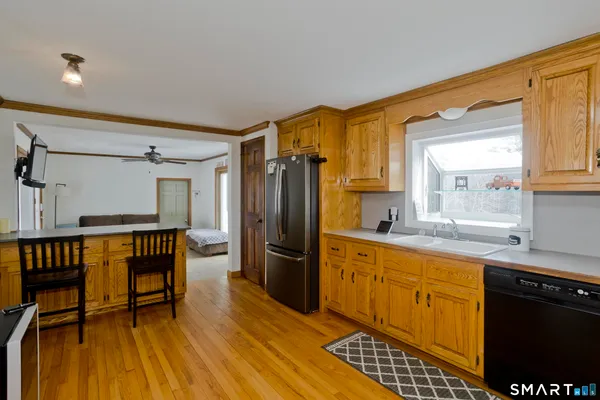 a kitchen with stainless steel appliances a refrigerator and a stove top oven