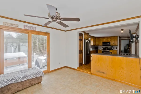 a view of living room kitchen and entryway
