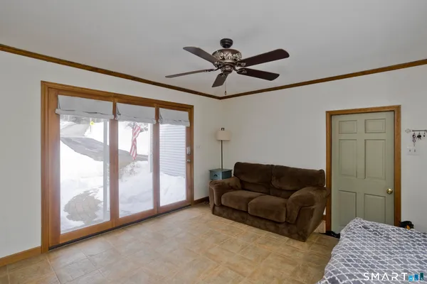 a living room with furniture and a window