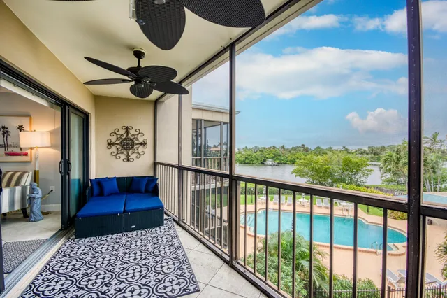 a view of a balcony with furniture