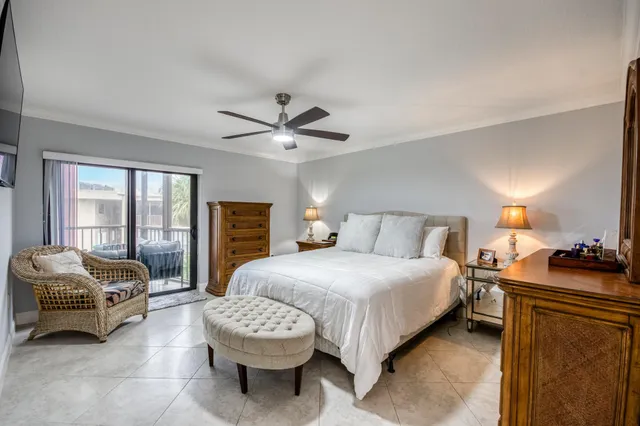 a bedroom with a bed a couch and dresser