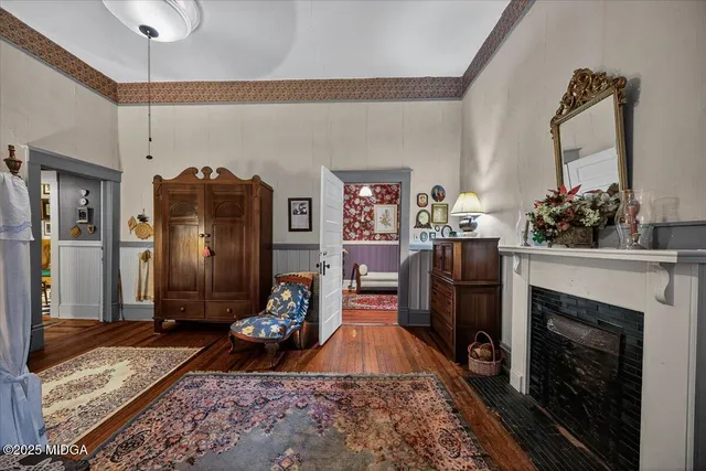 a bedroom with a bed and a fireplace