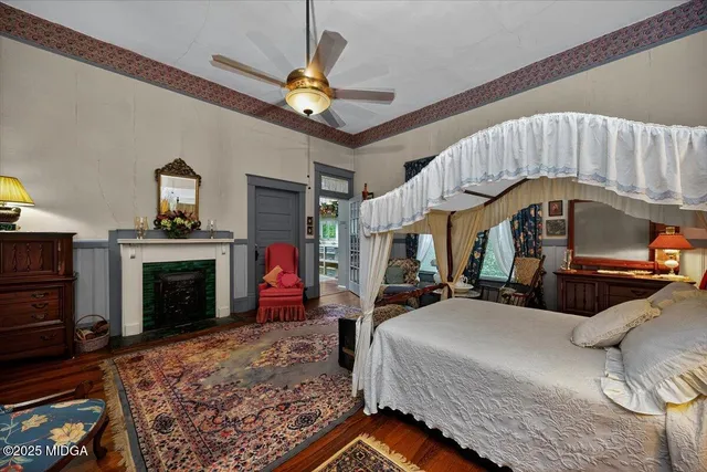 a bedroom with furniture and a window