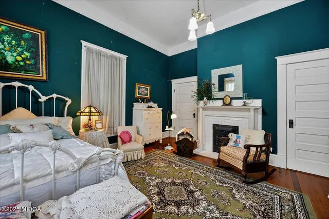 a living room with furniture fireplace and window