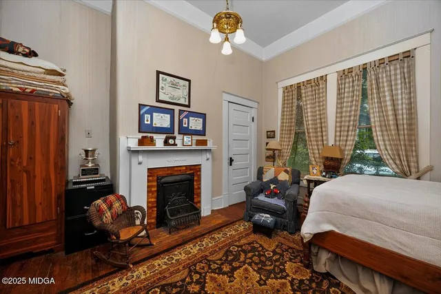 a bedroom with bed and a window