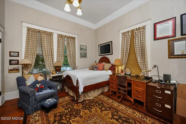 a bathroom with a toilet and a shower curtain