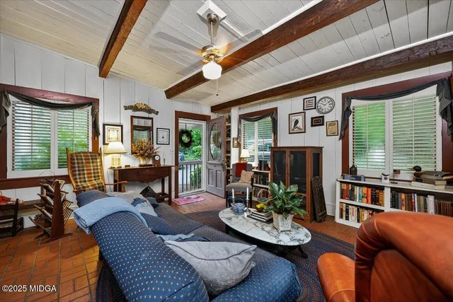 a living room with furniture and a window
