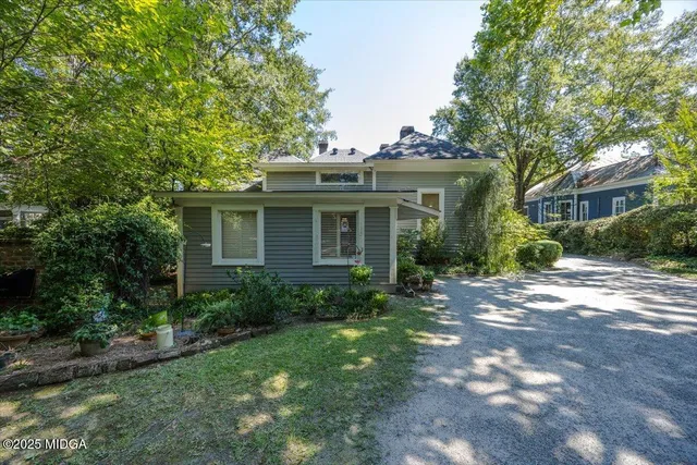 a backyard of a house with lots of green space