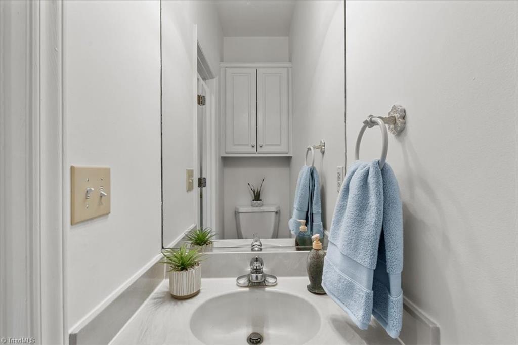 1213 Raspberry Run Graham, NC 27253 - Photo 24 of 39 1/2 Bath outside of den and garage