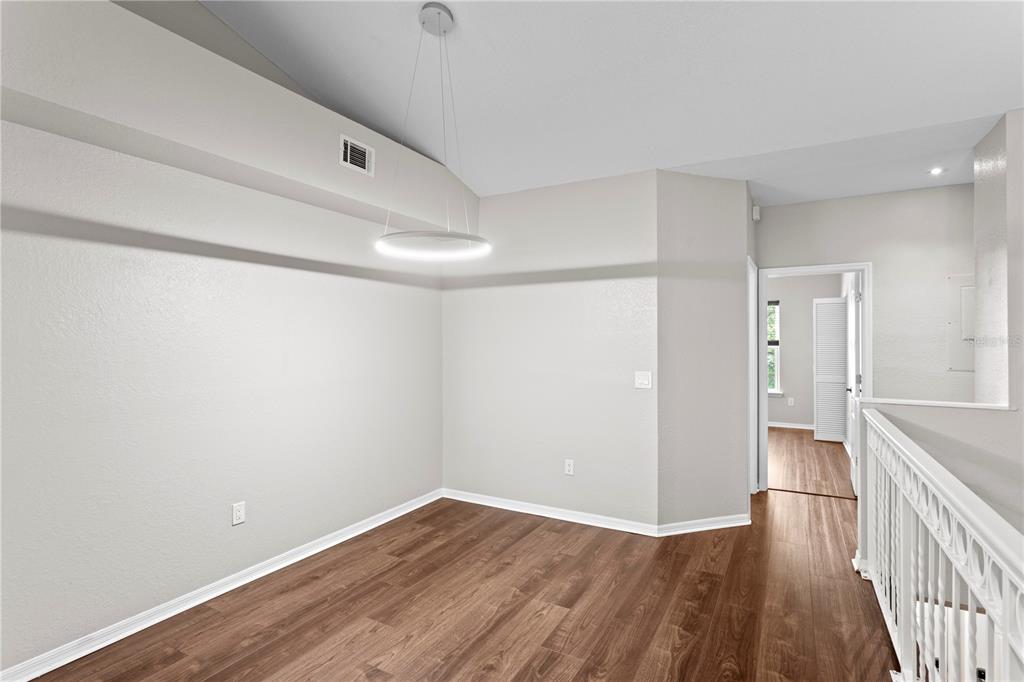 943 Normandy Trace Road Tampa, FL 33602 - Photo 12 of 51 a view of a hallway with wooden floor