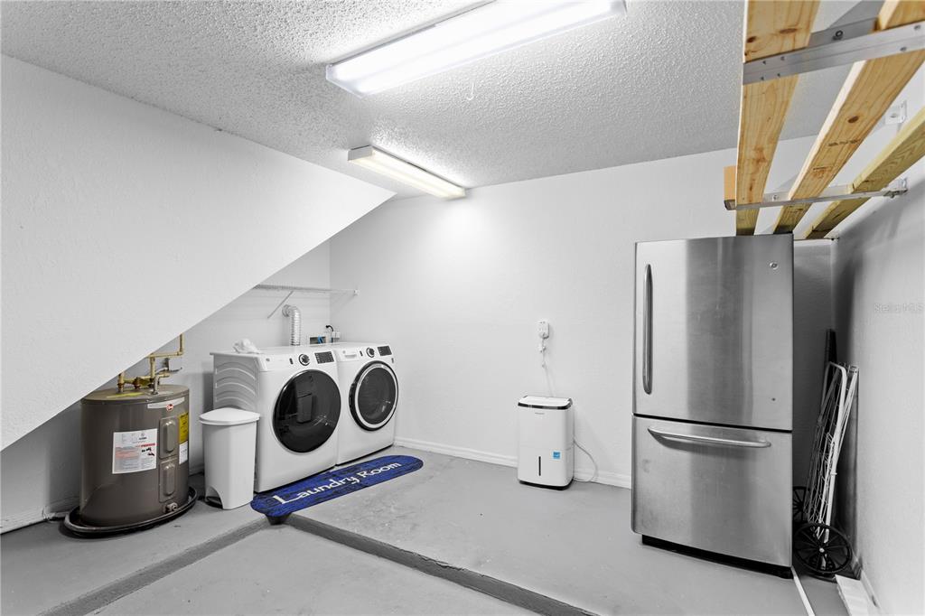 943 Normandy Trace Road Tampa, FL 33602 - Photo 29 of 51 a kitchen with a refrigerator and a stove top oven