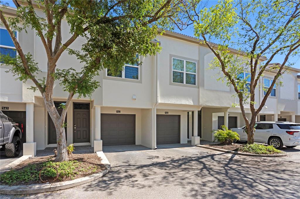 943 Normandy Trace Road Tampa, FL 33602 - Photo 30 of 51 a front view of a house with a yard and potted plants