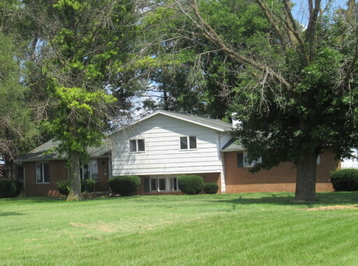 2202 Cr E 2400 Rd Street North St. Joseph, IL 61873 - Photo 1 of 11 a front view of house with yard and trees